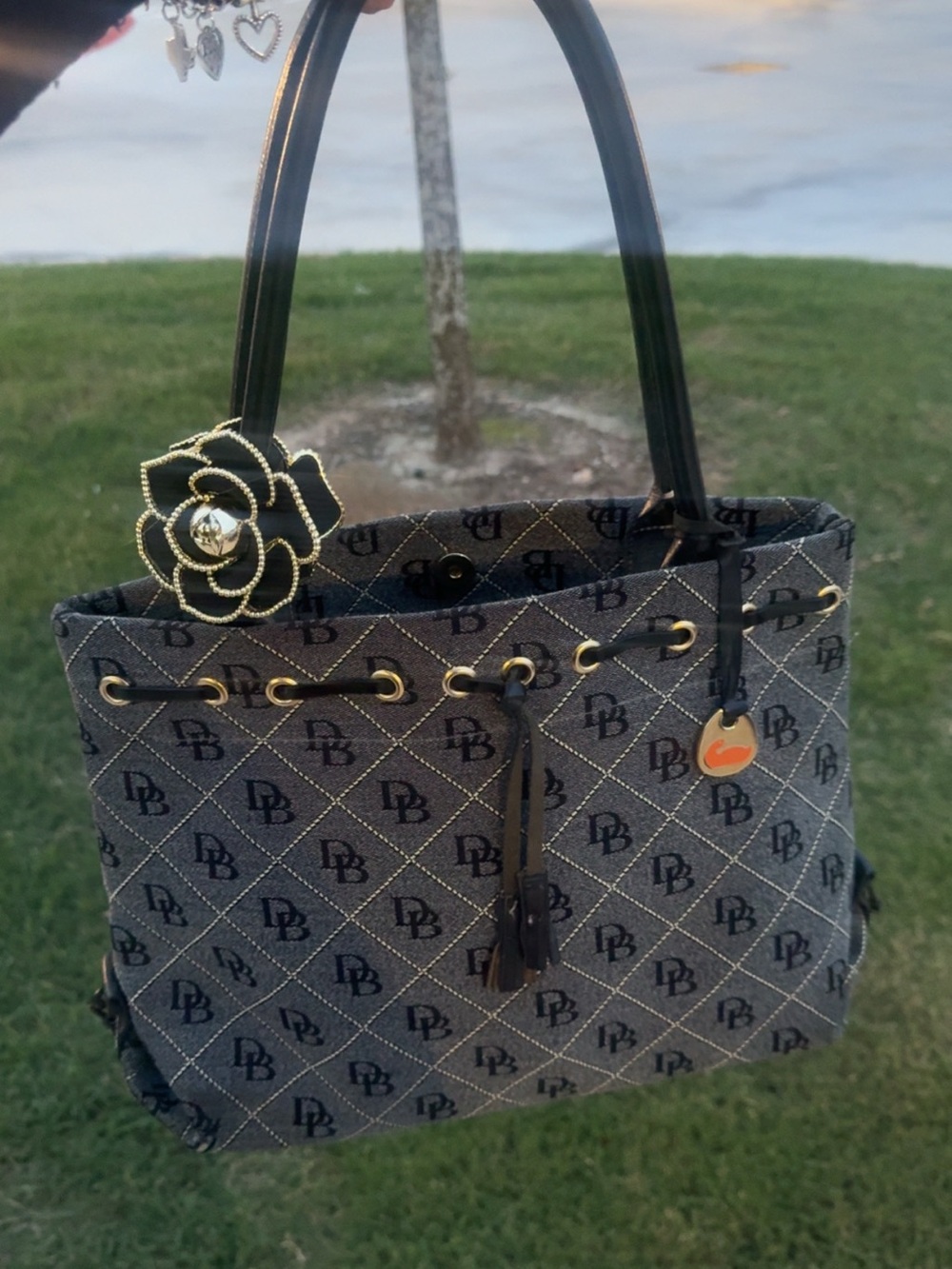 Vintage Dooney & Bourke monogram canvas drawstring shoulder bag.